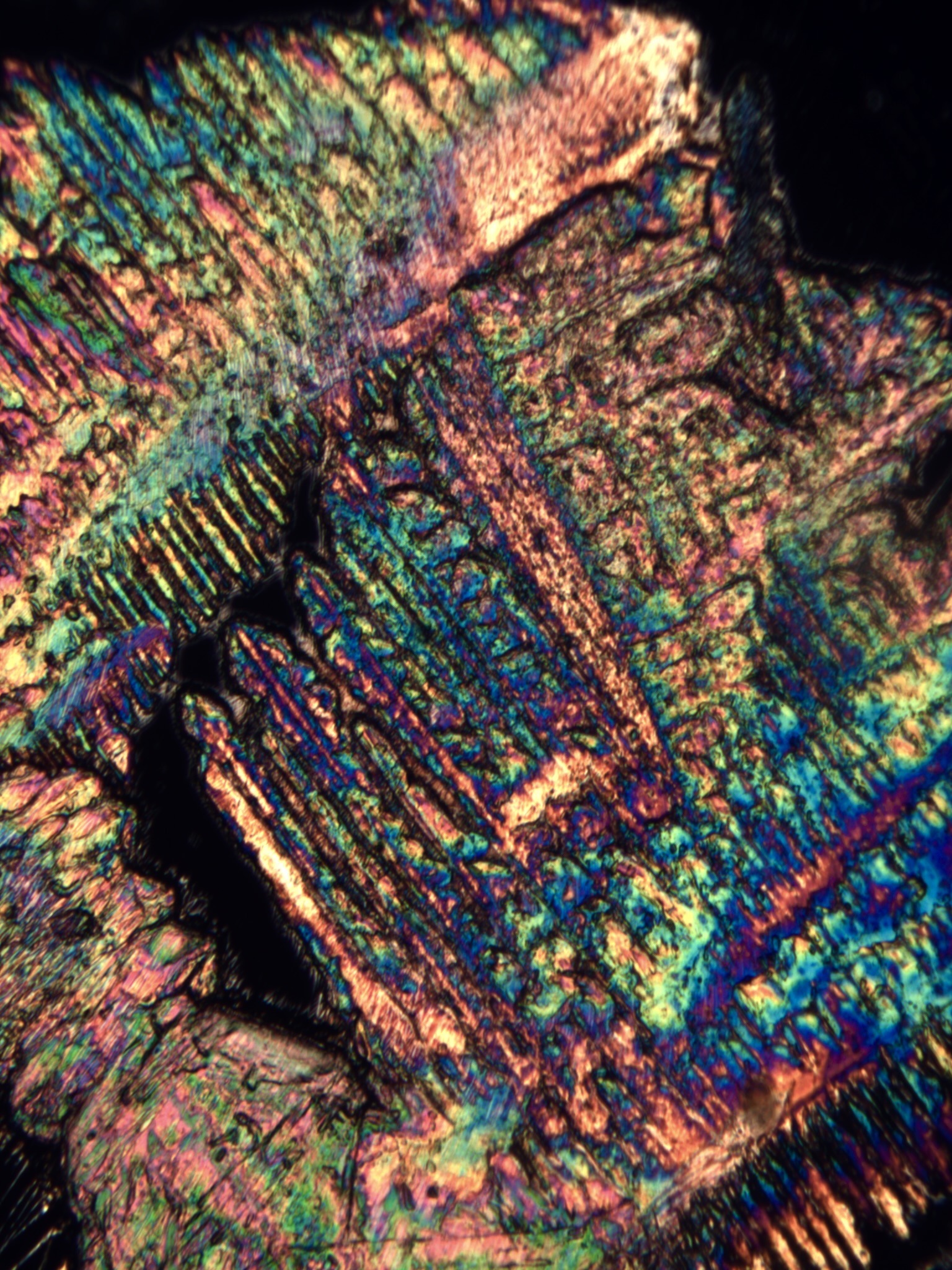 Close detail of a crystal structure formed from cremated remains, showing intricate color and pattern